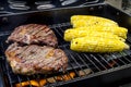 Steak and Corn on Hot Grill Royalty Free Stock Photo