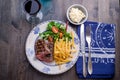 Steak dinner with fries and sauce Royalty Free Stock Photo