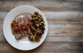 Steak and Eggplant Dinner on Wooden Background Royalty Free Stock Photo