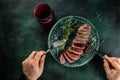 steak for a festive dinner with glasses of red wine on a dark background. top view. copy space for text Royalty Free Stock Photo