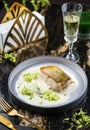 Steak fillet fish with cream cheese and vegetables on plate on marble background with drinks. Healthy seafood, top view Royalty Free Stock Photo