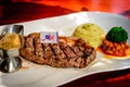 Steak with gravy, mashed potato, salsa on white porecelain plate Royalty Free Stock Photo