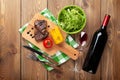 Steak with grilled corn, salad and red wine Royalty Free Stock Photo