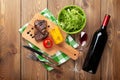 Steak with grilled corn, salad and red wine Royalty Free Stock Photo