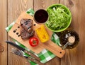 Steak with grilled corn, salad and red wine Royalty Free Stock Photo