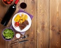 Steak with grilled potato, corn, salad and red wine Royalty Free Stock Photo