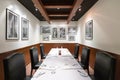 Steak house restaurant interior design with contemporary luxury furniture in New York style, elegant black leather chairs.