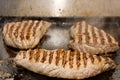 Steak on industrial grill Royalty Free Stock Photo