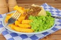 Steak And Kidney Pudding Meal With Chips And Mushy Peas Royalty Free Stock Photo