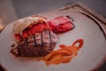 Steak & Lobster dish on white plate Royalty Free Stock Photo