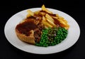 Steak Pie, fries, peas and gravy Royalty Free Stock Photo