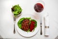 Steak on the plate with red wine. Royalty Free Stock Photo