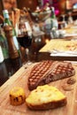 Steak with potato with corn and red wine Royalty Free Stock Photo