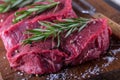 Steak. Raw beef steak. Fresh raw Sirloin beef steak sliced o Herb - Rosemary decoration Royalty Free Stock Photo