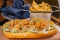 Steak Sandwich with french fries bucket served on wooden board isolated on table top view of arabic fastfood Royalty Free Stock Photo