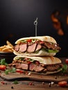 A steak sandwich sits on a wooden cutting board. Royalty Free Stock Photo