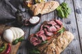 Steak sandwich, sliced roast beef, cheese,spinach leaves,tomato Royalty Free Stock Photo