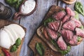 Steak sandwich, sliced roast beef, cheese,spinach leaves,tomato,white sauce Royalty Free Stock Photo