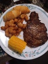 Steak shrimp corn on the cob and tasty crescent rolls