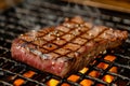 A steak is sizzling on a grill as flames lick its surface, creating a mouthwatering charred crust, Kobe Beef steak, grilled to Royalty Free Stock Photo