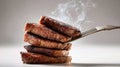 Steak slices steaming, stacked and lifted by fork Royalty Free Stock Photo