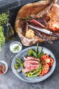 Steak slices with tomatos, asparagus and herbs and on the platt Royalty Free Stock Photo