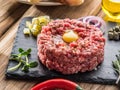 Steak tartare served with raw quail egg yolk and other tartare ingredient Royalty Free Stock Photo