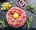 Steak tartare served with raw quail egg yolk and other tartare ingredient. Top view Royalty Free Stock Photo