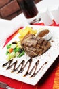 Steak tenderloin with garnish on table