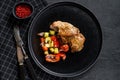 Steak thigh Turkey fillet with vegetables. Black background. Top view