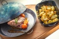 Steak with tomatoes and baked potatoes, metal pan, dinner or lunch food, restaurant Royalty Free Stock Photo