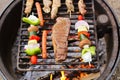 Steak and Vegetable Shish Kabobs Cookin on Fire Grill Royalty Free Stock Photo