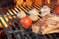 Steak and Vegetables Char-Grilled Over Flaming BBQ Grill Royalty Free Stock Photo