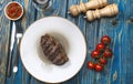 steak in white plate and a glass of wine Royalty Free Stock Photo