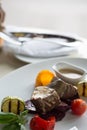 Steaks in a creamy sauce with baked vegetables Royalty Free Stock Photo