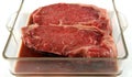 Steaks marinating Royalty Free Stock Photo