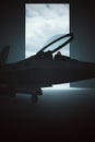 Stealth Fighter Jet Aircraft in a Dark Hanger Royalty Free Stock Photo