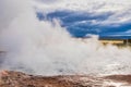 Steam around the hole where the hot water is bubbling, geothermal energy, Husavik, Iceland