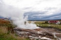 Steam around the hole where the hot water is bubbling, geothermal energy, Husavik, Iceland