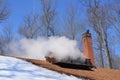 Steam billowing from a maple syrup sugar shack Royalty Free Stock Photo
