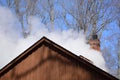 Steam billowing from a maple syrup sugar shack Royalty Free Stock Photo