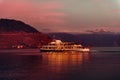 Steam boat with swiss and french flags floating on Lake Geneva