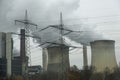 Steam clouds rising from cooling towers of power station. Royalty Free Stock Photo