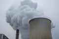 Steam clouds rising from cooling towers of power station. Royalty Free Stock Photo