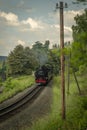 Steam engine train with passengers in summer day near Neudorf Germany 06 14 2023