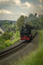 Steam engine train with passengers in summer day near Neudorf Germany 06 14 2023