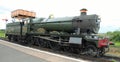 STEAM ENGINE BY A WATER TOWER