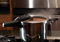 Steam escaping from new pressure cooker pot Royalty Free Stock Photo