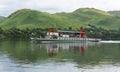 Steam ferry with holidaymakers and tourists Ullswater Lake District with green hills