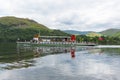 Steam ferry with holidaymakers and tourists Ullswater Lake District with green hills